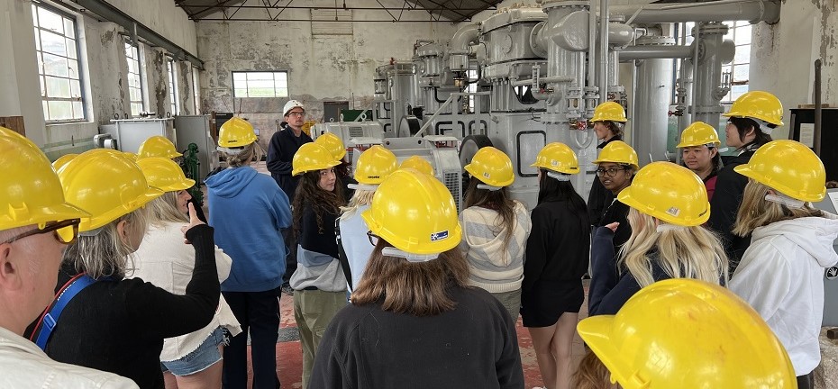 students on a field trip in hard hats