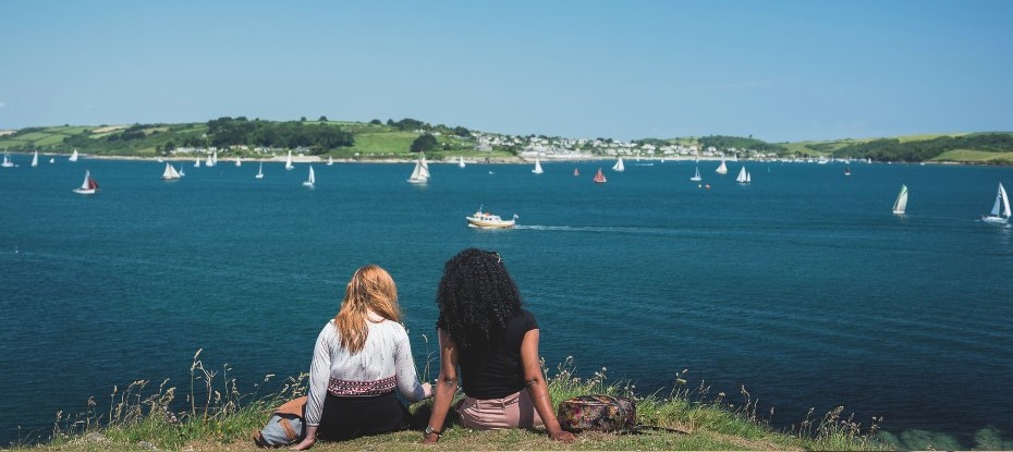 two students looking out over Falmouth bay