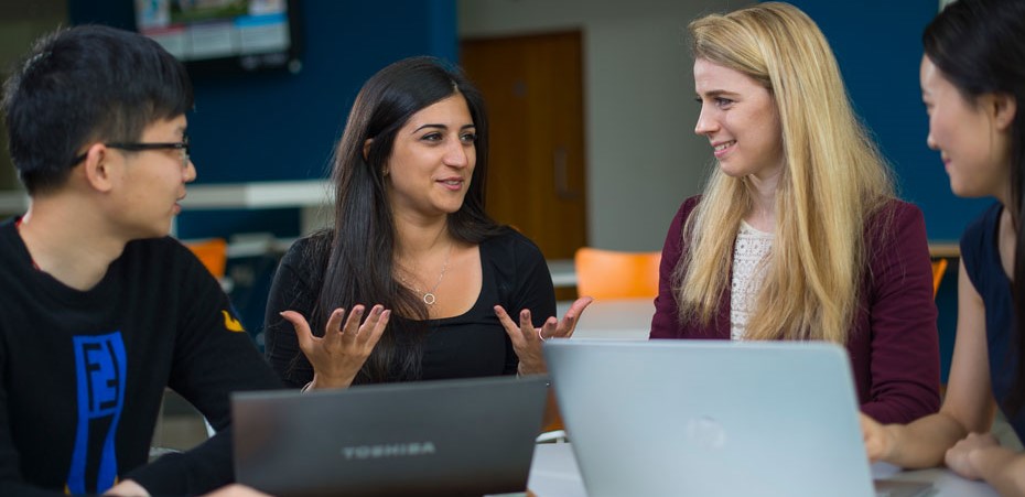 Four students chatting