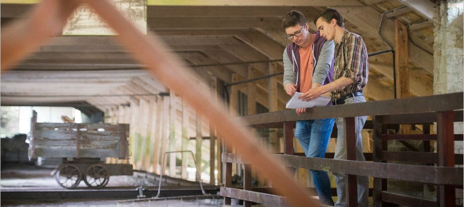 two students in a heritage building