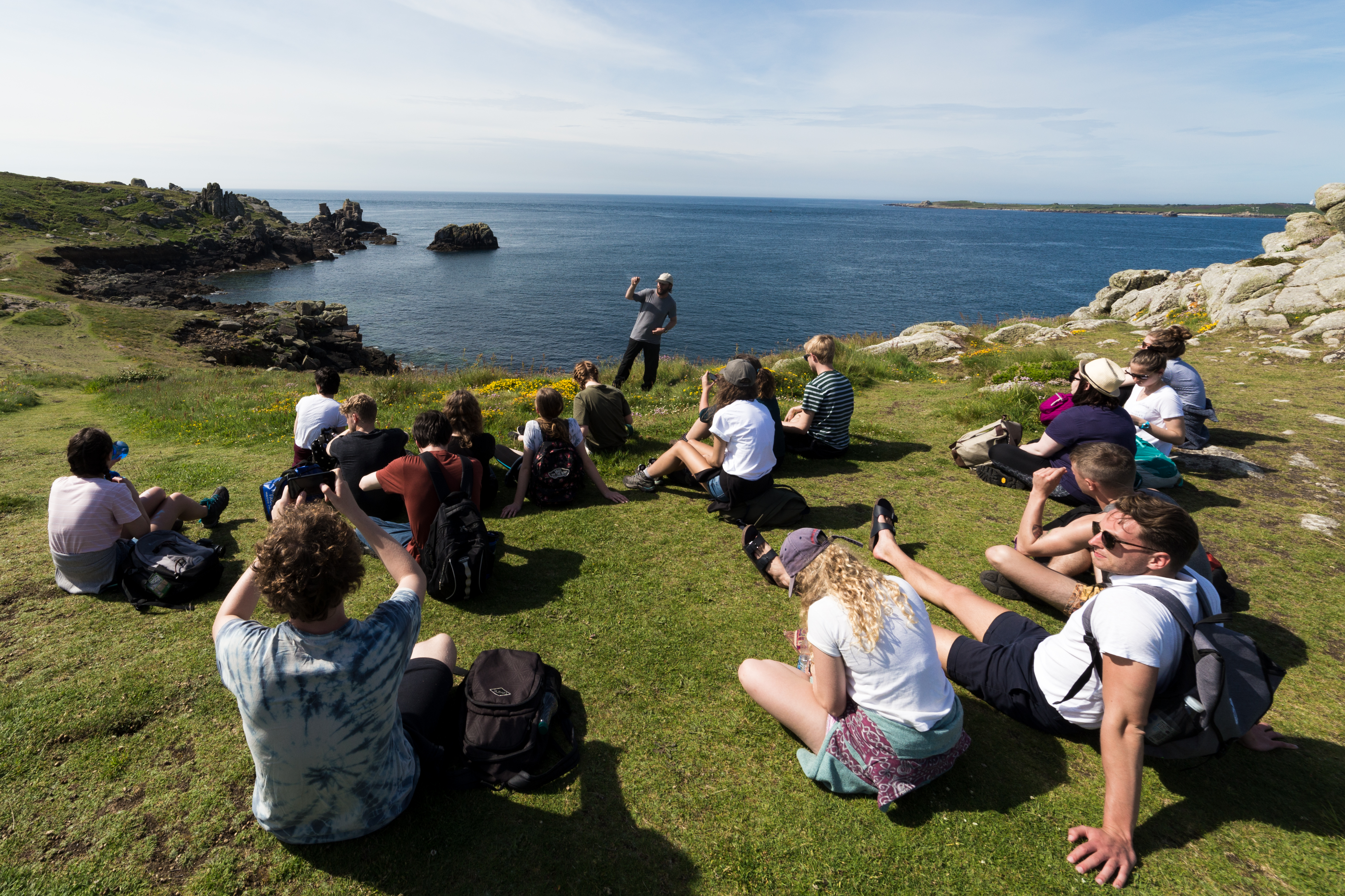 students on the coast in Cornwall