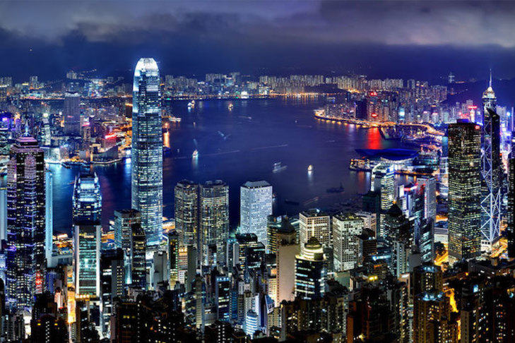 Skyscrapers at night overlooking a lake