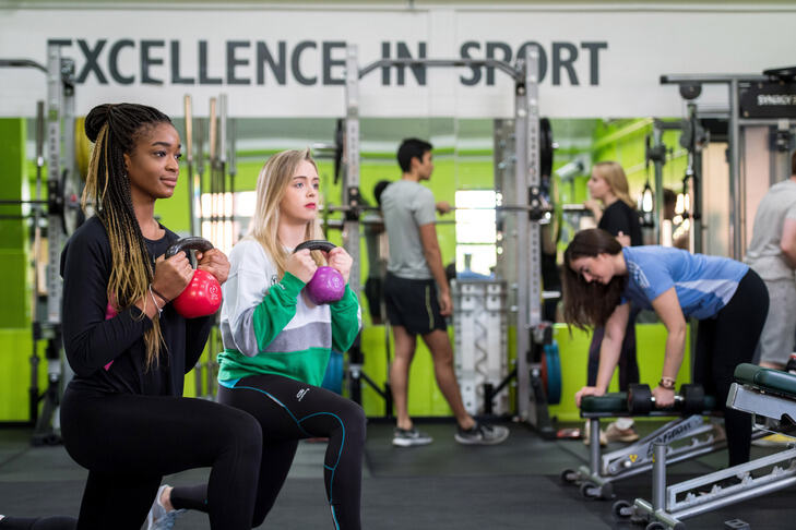 Students working out using kettlebells at St Luke's gym