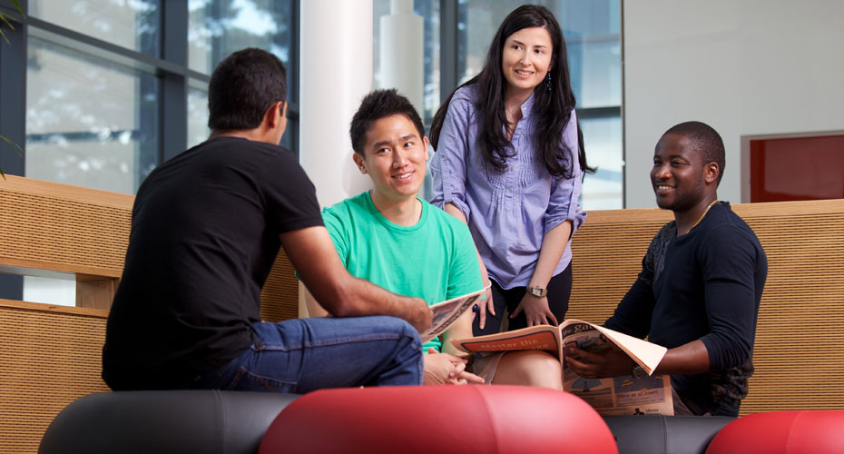 Four students sitting in group
